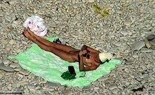 A Dude With A Hidden Camera Stalks A Chick At The Beach