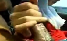 malay hijab girl giving a handjob