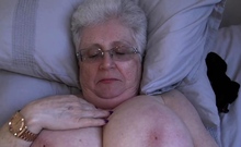 Grey granny Caroline V plays with huge tits and toys pussy