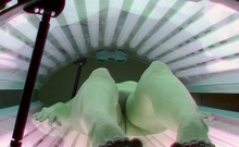 Young beauty in solarium